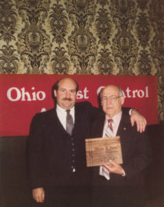 Father and son celebrate the end of Orlando’s term as president of the then-Ohio Pest Control Association in 1977. (Photo: Lonnie Alonso)