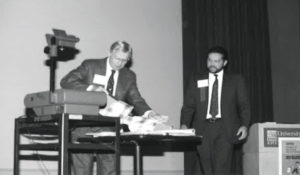 Mueller, right, assists mentor and good friend Dr. John Osmun during a mid-1980s Purdue Conference presentation. (PHOTO: DAVE MUELLER)